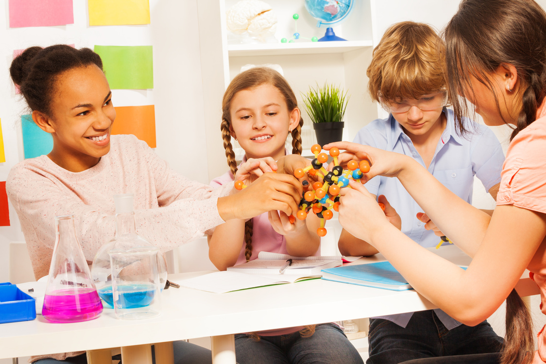 Kids Assembling Molecule Model for Science Project