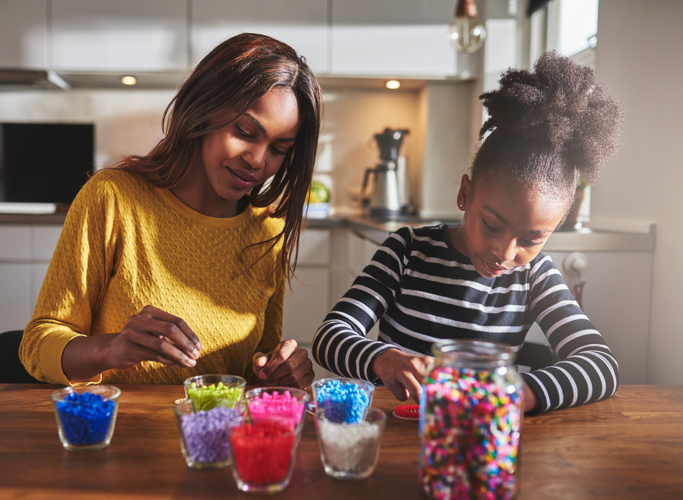 Child and Parent Working on Beaded Crafts